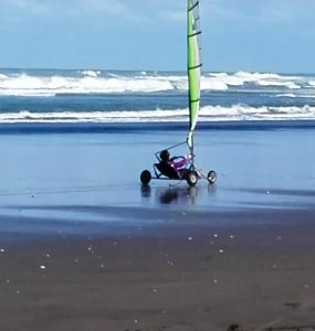 Me, whizzing through the wet sand!